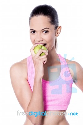 Beautiful Woman Biting Green Apple Stock Photo