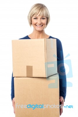 Beautiful Woman Carrying Cardboard Boxes Stock Photo