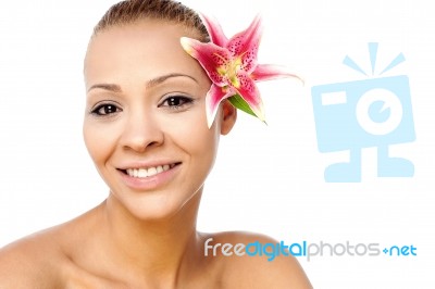 Beautiful Woman Face With Fresh Flower Stock Photo