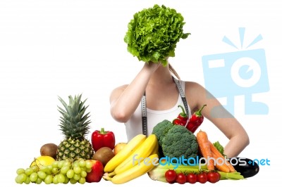 Beautiful Woman Hiding Her Face With Spinach Stock Photo