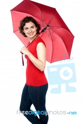 Beautiful Woman Holding A Red Umbrella Stock Photo