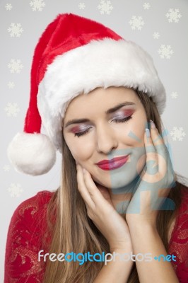 Beautiful Woman In Santa Hat Stock Photo