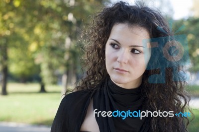 Beautiful Woman In The Park Stock Photo