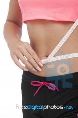 Beautiful Woman Is Measuring Her Waist Stock Photo