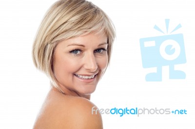 Beautiful Woman Looking Over Shoulder Stock Photo