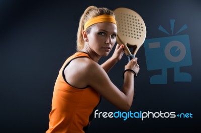 Beautiful Woman Playing Padel Indoor. Isolated On Black Stock Photo