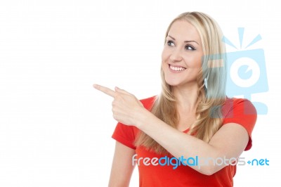 Beautiful Woman Pointing At Something Stock Photo