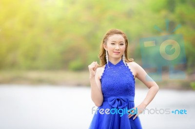 Beautiful Woman Wear Blue Evening Dress Over Mountains And River… Stock Photo