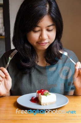 Beautiful Woman With A Cake In Cafe Stock Photo