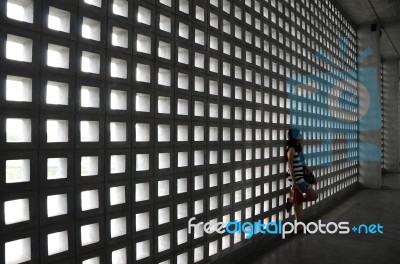 Beautiful Woman With A Very Sad Expression In Dramatic Space Stock Photo