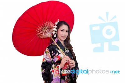 Beautiful Young Asian Woman Wearing Traditional Japanese Kimono With Red Umbrella Isolated On White Background Stock Photo