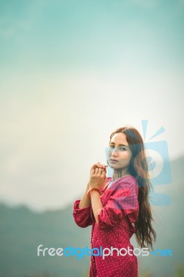 Beautiful Young Attractive  Asian Women In Red Dress On Sunrise Beautiful Nature Background Of The Mountains And Lotus Garden Image Of Happy  Camping, Travel, Lifestyle Resting , Relaxing Concept Vintage Style Stock Photo