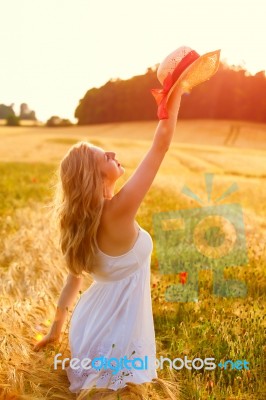 Beautiful Young Blonde Scottish Girl In White Dress At Golden Wh… Stock Photo