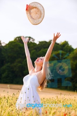 Beautiful Young Blonde Scottish Girl In White Dress At Golden Wh… Stock Photo