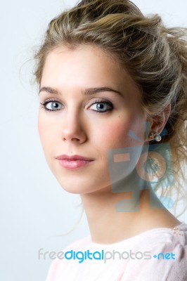 Beautiful Young Blonde Woman Looking At The Camera Stock Photo