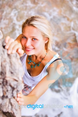 Beautiful Young Blonde Woman Posing Outdoor At The Rocky Sea Sho… Stock Photo