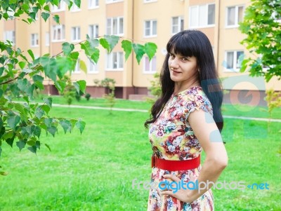 Beautiful Young Brunette In A Park Stock Photo