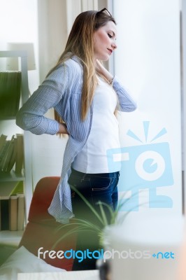 Beautiful Young Businesswoman Taking A Break In The Office Stock Photo