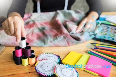 Beautiful Young Fashion Designer Woman Choosing Thread For Sewin… Stock Photo