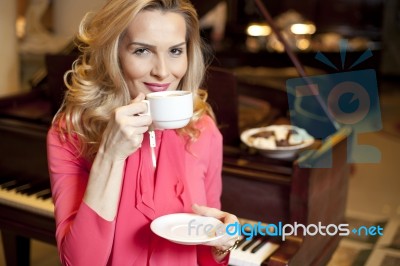 Beautiful Young Girl Drinking Coffee Stock Photo