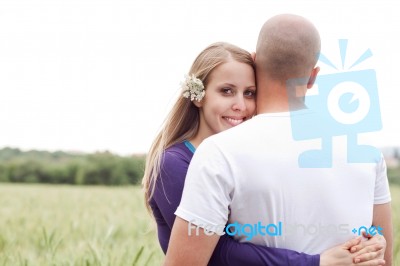 Beautiful Young Lady Hugging Her Husband Stock Photo