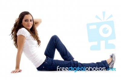 Beautiful Young Model Sitting On Ground Stock Photo