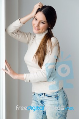 Beautiful Young Woman At Home Stock Photo