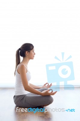 Beautiful Young Woman Doing Yoga Exercises At Home Stock Photo