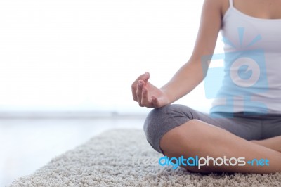 Beautiful Young Woman Doing Yoga Exercises At Home Stock Photo