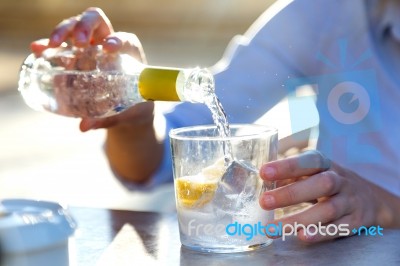 Beautiful Young Woman Drinking Soda In A Restaurant Terrace Stock Photo