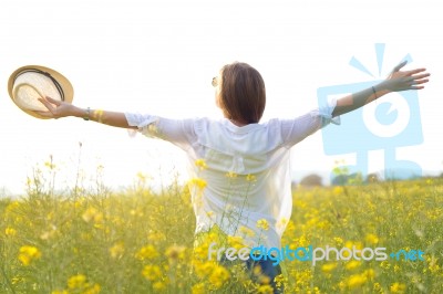 Beautiful Young Woman Enjoying Summer In A Field Stock Photo