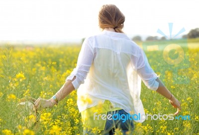 Beautiful Young Woman Enjoying Summer In A Field Stock Photo