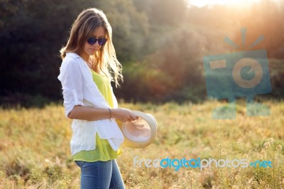 Beautiful Young Woman Enjoying Summer In A Field Stock Photo