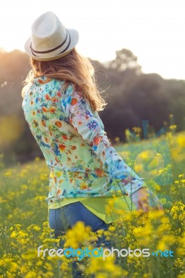 Beautiful Young Woman Enjoying Summer In A Field Stock Photo