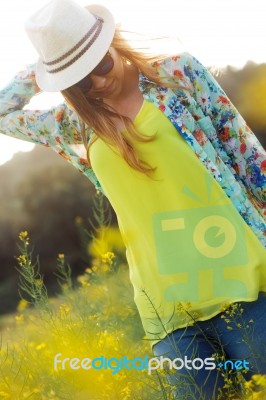 Beautiful Young Woman Enjoying Summer In A Field Stock Photo