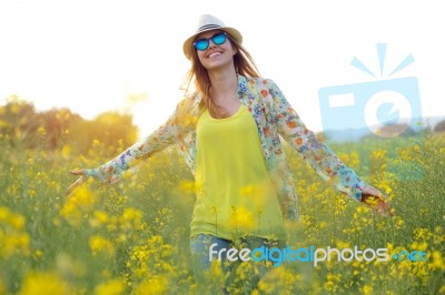 Beautiful Young Woman Enjoying Summer In A Field Stock Photo