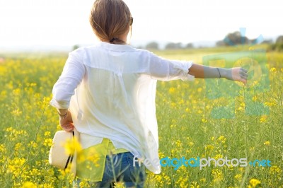 Beautiful Young Woman Enjoying Summer In A Field Stock Photo