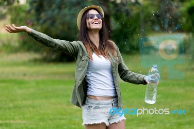 Beautiful Young Woman Enjoying Summer With Water Stock Photo