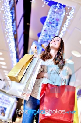 Beautiful Young Woman Holding Shopping Bags Stock Photo