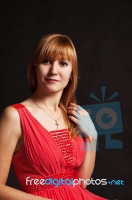 Beautiful Young Woman In A Red Dress Stock Photo