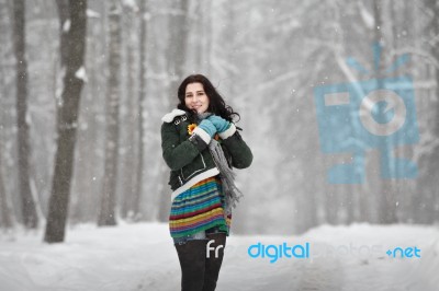 Beautiful Young Woman In A Sweater On A Winter Walk In A Park Stock Photo