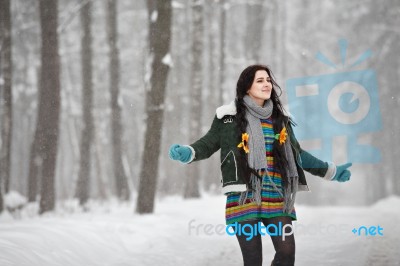 Beautiful Young Woman In A Sweater On A Winter Walk In A Park Stock Photo