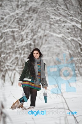 Beautiful Young Woman In A Sweater On A Winter Walk In A Wood Stock Photo