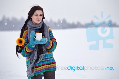 Beautiful Young Woman In A Sweater On A Winter Walk With A Cup O… Stock Photo