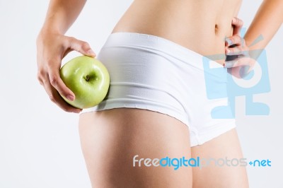 Beautiful Young Woman In White Underwear Holding Green Apple Stock Photo