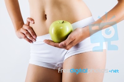 Beautiful Young Woman In White Underwear Holding Green Apple Stock Photo