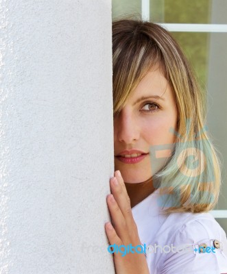 Beautiful Young Woman Near White Column Stock Photo