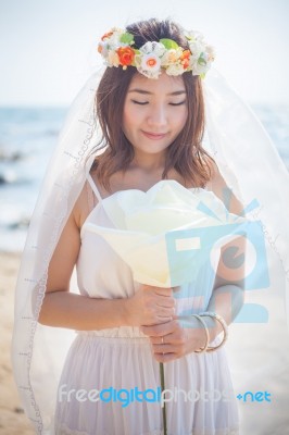 Beautiful Young Woman On The Beach Stock Photo