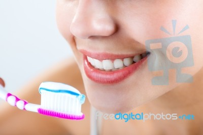 Beautiful Young Woman Picking His Teeth Stock Photo