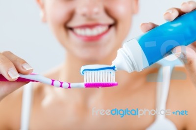 Beautiful Young Woman Picking His Teeth Stock Photo